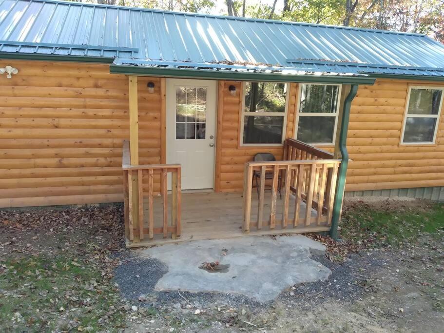 Cabin with a tree house on a buffalo farm .