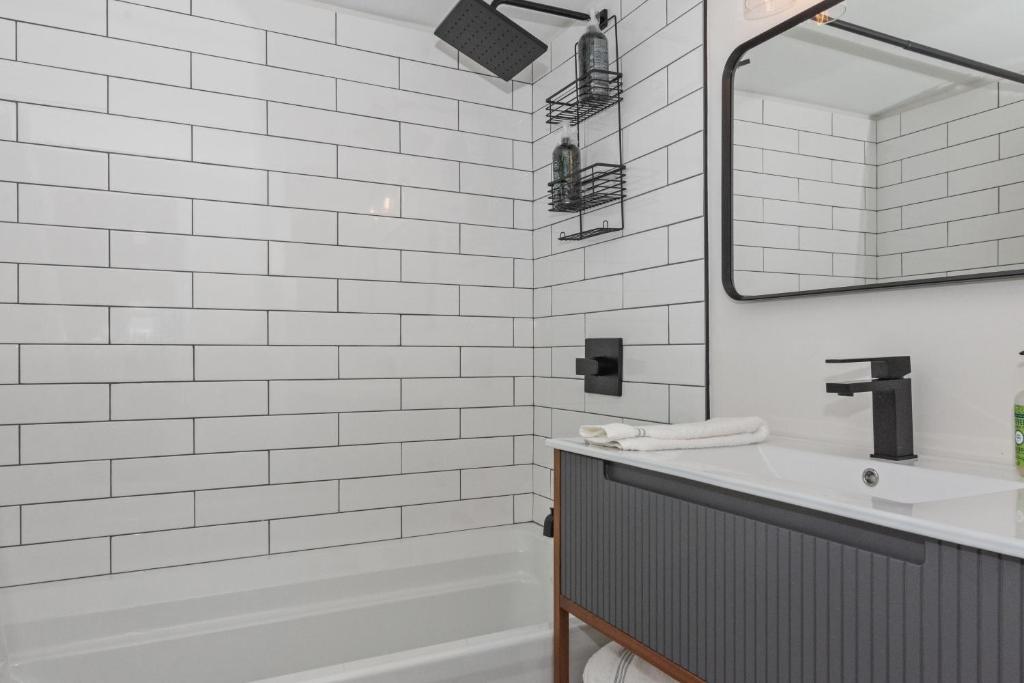 Modern Waterfront Retreat with Hot Tub & Pond Views