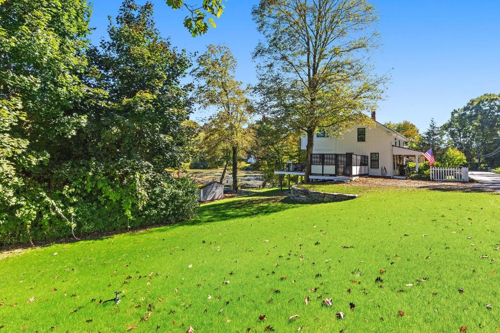 Modern Waterfront Retreat with Hot Tub & Pond Views - Image 6