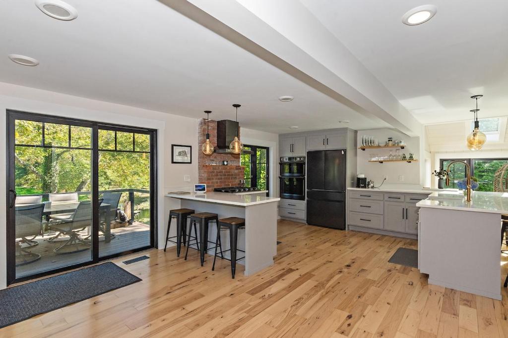 Modern Waterfront Retreat with Hot Tub & Pond Views - Image 4