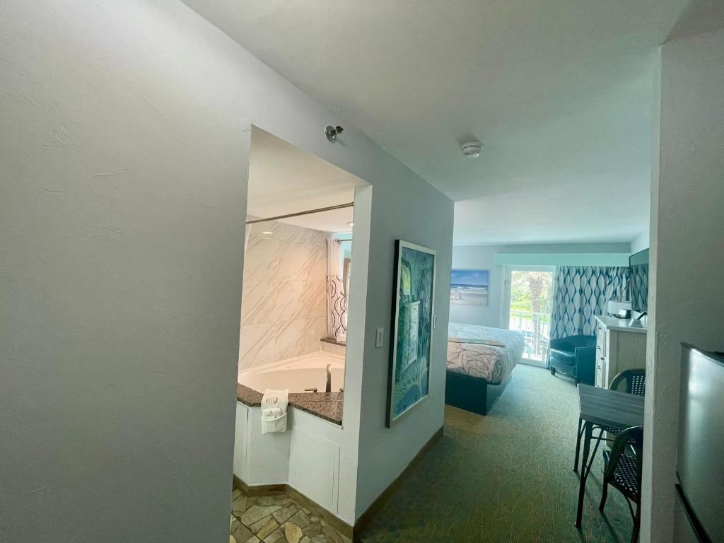 Ocean Sands Beach Boutique Inn-1 Acre Private Beach-St Augustine Historic-2 Miles-Shuttle with Downtown Tour-HEATED Salt Water Pool until 420AM-Popcorn-Cookies-New 4k USD Black Beds- 69 Item Breakfast-Eggs-Bacon-Starbucks- Free Laundry- #904-799-SAND