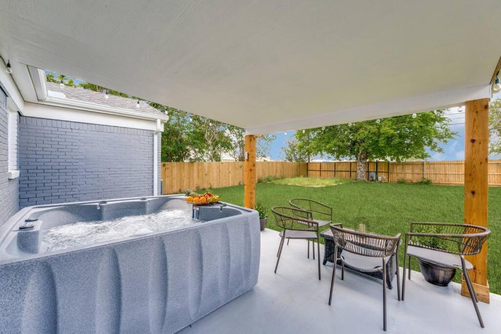 Spacious 4BR Home, Lux Hot Tub & Secure Gated Yard, Near Airport & Attractions